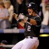 DENVER - SEPTEMBER 25:  Shortstop Troy Tulowitzki #2 of the Colorado Rockies celibrates after scoring the game-winning run against the St. Louis Cardinals on a sacrifice fly by Yorvit Torrealba in the ninth inning at Coors Field on September 25, 2009 in D