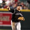 PHOENIX - SEPTEMBER 20:  Infielder Troy Tulowitzki #2 of the Colorado Rockies fields a ground ball out during the major league baseball game against the Arizona Diamondbacks at Chase Field on September 20, 2009 in Phoenix, Arizona. The Rockies defeated th