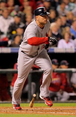 DENVER - SEPTEMBER 25:  Matt Holliday #15 of the St. Louis Cardinals singles in the sixth inning off of relief pitcher Jose Contreras of the Colorado Rockies at Coors Field on September 25, 2009 in Denver, Colorado.  (Photo by Doug Pensinger/Getty Images)