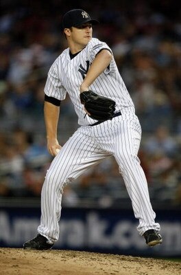 NEW YORK - SEPTEMBER 26:  Phil Hughes #65 of the New York Yankees pitches against the Boston Red Sox during the game on September 26, 2009 at Yankee Stadium in the Bronx borough of New York City.  (Photo by Jared Wickerham/Getty Images)