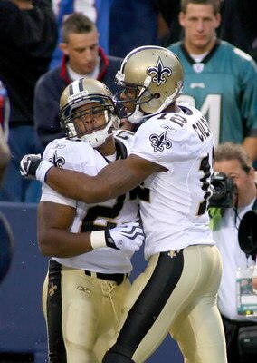 ORCHARD PARK, NY - SEPTEMBER 27: Pierre Thomas #23 and Marques Colston #12 of the New Orleans Saints celebrate Thomas' touchdown in the fourth quarter against the Buffalo Bills at Ralph Wilson Stadium on September 27, 2009 in Orchard Park, New York. The S