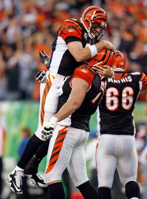 CINCINNATI - SEPTEMBER 27:  Carson Palmer #9 of the Cincinnati Bengals celebrates with teammate Andrew Whitworth #77 after throwing for the game winning touchdown against the Pittsburgh Steelers at Paul Brown Stadium on September 27, 2009 in Cincinnati, O