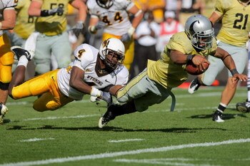 BOULDER, CO - SEPTEMBER 19:  Running back Rodney Stewart #5 of the Colorado Buffaloes dives into the endzone as Tashaun Gipson #4 of the Wyoming Cowboys attempts to make the stop at Folsom Field on September 19, 2009 in Boulder, Colorado. Stewart's third 