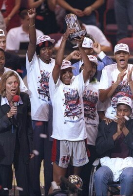 30 Aug 1997:  Cynthia Cooper of the Houston Comets celebrates with her teammates after the championship game against the New York Liberty at The Summit in Houston, Texas.  The Comets won the game, 65-51. Mandatory Credit: Todd Warshaw  /Allsport
