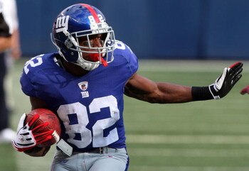 EAST RUTHERFORD, NJ - SEPTEMBER 13:  Mario Manningham #82 of the New York Giants runs in a second quarter touchdown against the Washington Redskins on September 13, 2009 at Giants Stadium in East Rutherford, New Jersey.  (Photo by Jim McIsaac/Getty Images