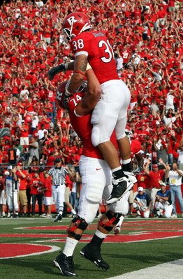 PISCATAWAY, NJ - SEPTEMBER 07:  Joe Martinek #38 of the Rutgers Scarlet Knights celebrates his touchdown against the Cincinnati Bearcats with teammate Howard Barbieri #74 at Rutgers Stadium on September 7, 2009 in Piscataway, New Jersey.  (Photo by Jim Mc