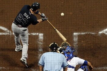 NEW YORK - AUGUST 19:  Matt Diaz #23 of the Atlanta Braves connects for a second inning two run single against the New York Mets on August 19, 2009 at Citi Field in the Flushing neighborhood of the Queens borough of New York City.  (Photo by Jim McIsaac/G
