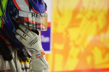 SINGAPORE - SEPTEMBER 25:  Romain Grosjean of France and Renault prepares to drive during practice for the Singapore Formula One Grand Prix at the Marina Bay Street Circuit on September 25, 2009 in Singapore.  (Photo by Mark Thompson/Getty Images)