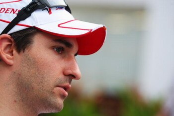 SINGAPORE - SEPTEMBER 27:  Timo Glock of Germany and Toyota is interviewed before the Singapore Formula One Grand Prix at the Marina Bay Street Circuit on September 27, 2009 in Singapore.  (Photo by Mark Thompson/Getty Images)