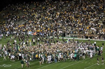 BOULDER, CO - SEPTEMBER 06:  Colorado State fans rush the field to celebrate with the Colorado State Rams after they defeated the Colorado Buffaloes 23-17 at Folsom Field on September 6, 2009 in Boulder, Colorado.  (Photo by Doug Pensinger/Getty Images)