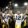 STATE COLLEGE, PA - SEPTEMBER 26:  Ricky Stanzi #12 of the Iowa Hawkeyes celebrates a 21-10 victory over the Penn State Nittnay Lions with Travis Meade #61 on September 26, 2009 at Beaver Stadium in State College, Pennsylvania.  (Photo by Gregory Shamus/G