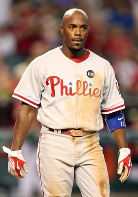 PHOENIX - JULY 28:  Jimmy Rollins #11 of the Philadelphia Phillies walks to the dugout during the major league baseball game against the Arizona Diamondbacks at Chase Field on July 28, 2009 in Phoenix, Arizona.   The Phillies defeated the Diamondbacks 4-3