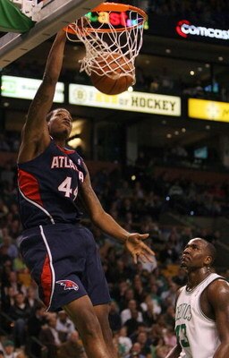 BOSTON - NOVEMBER 12:  Solomon Jones #44 of the Atlanta Hawks dunks the ball as Kendrick Perkins #43 of the Boston Celtics watches on November 12,  2008 at TD Banknorth Garden in Boston, Massachusetts. NOTE TO USER: User expressly acknowledges and agrees 
