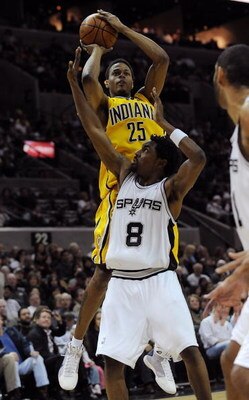 SAN ANTONIO - JANUARY 20:  Guard Brandon Rush #25 of the Indiana Pacers takes a shot against Roger Mason Jr. #8 of the San Antonio Spurs on January 20, 2009 at AT&T Center in San Antonio, Texas.  NOTE TO USER: User expressly acknowledges and agrees that, 