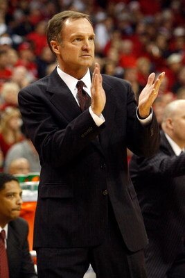 LAS VEGAS - DECEMBER 20:  Head coach Lon Kruger of the UNLV Rebels claps while taking on the Arzona Wildcats at the Thomas & Mack Center December 20, 2008 in Las Vegas, Nevada.  (Photo by Ethan Miller/Getty Images)