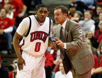 LAS VEGAS - JANUARY 03:  Head coach Lon Kruger of the UNLV Rebels talks to Oscar Bellfield #0 during a game against the New Mexico Lobos at the Thomas & Mack Center January 3, 2009 in Las Vegas, Nevada. The Rebels won 60-58.  (Photo by Ethan Miller/Getty 
