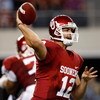 ARLINGTON, TX - SEPTEMBER 05:  Quarterback Landry Jones #12 of the Oklahoma Sooners at Cowboys Stadium on September 5, 2009 in Arlington, Texas.  (Photo by Ronald Martinez/Getty Images)