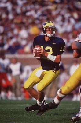 31 Aug 1996:  Quarterback Scott Dreisbach #12 of the Michigan Wolverines looks down field for an open receiver as he drops back to pass during the Wolverines 20-8 victory over the Illinois Fighting Illini at Michigan Stadium in Ann Arbor, Michigan.   Mand