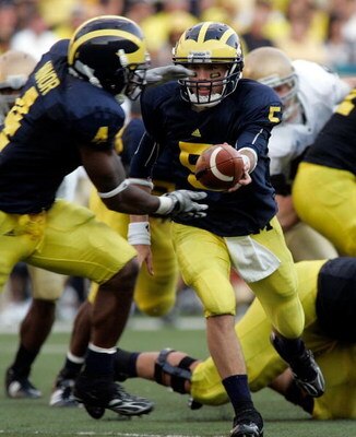 ANN ARBOR, MI - SEPTEMBER 12:  Quarterback Tate Forcier #5 hands off the ball to Brandon Minor #4 against Notre Dame at Michigan Stadium on September 12, 2009 in Ann Arbor, Michigan.  (Photo by Domenic Centofanti/Getty Images)