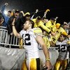 STATE COLLEGE, PA - SEPTEMBER 26:  Ricky Stanzi #12 of the Iowa Hawkeyes along with Adam Robinson #32 and Brett Morse #36 celebrate a 21-10 victory over the Penn State Nittnay Lions with Iowa fans on September 26, 2009 at Beaver Stadium in State College, 