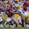 BATON ROUGE, LA - OCTOBER 25:  Knowshon Moreno #24 of Georgia outruns the tackle of Rahim Alem #84 in the second half of their football game at Tiger Stadium on October 25, 2008 in Baton Rouge, Louisiana.  Georgia won 52-38. (Photo by Dave Martin/Getty Im