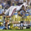 PASADENA, CA - SEPTEMBER 30:  UCLA Bruins Quarterback Ben Olson goes down as Stanford Cardinal cornerback Brandon Harrison #23 dives over him during the game on September 30, 2006 at the Rose Bowl in Pasadena, California.  (Photo by Jeff Gross/Getty Image