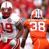 JACKSONVILLE, FL - JANUARY 1:  Quentin Castille #19 of the Nebraska Cornhuskers attempts to allude the tackle of Chris Chancellor #38 of the Clemson Tigers during the Konica Minolta Gator Bowl at Jacksonville Municipal Stadium January 1, 2009 in Jacksonvi
