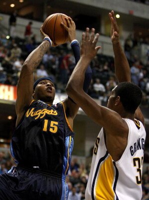 INDIANAPOLIS - NOVEMBER 10:  Carmelo Anthony #15 of the Denver Nuggets shoots the ball while defended by Danny Granger #33 of the Indiana Pacers at Conseco Fieldhouse November 10, 2007 in Indianapolis, Indiana. The Nuggets won 113-106. NOTE TO USER: User 