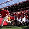 PISCATAWAY, NJ - OCTOBER 18:  Head coach Greg Schiano of the Rutgers Scarlet Knights leads his team onto the field to play the Connecticut Huskies at Rutgers Stadium on October 18, 2008 in Piscataway, New Jersey.  (Photo by Jim McIsaac/Getty Images)