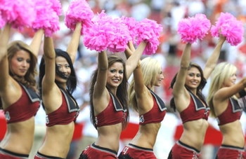 TAMPA, FL - OCTOBER 12: Cheerleaders of the Tampa Bay Buccaneers carry pink pom pons to promote breast cancer awareness  against the Carolina Panthers at Raymond James Stadium on October 12, 2008 in Tampa, Florida.  (Photo by Al Messerschmidt/Getty Images