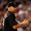 DENVER - JULY 03:  Manager Fredi Gonzalez #33 of the Florida Marlins makes a pitching change during action against  the Colorado Rockies at Coors Field on July 3, 2008 in Denver, Colorado. The Rockies defeated the Marlins 6-5 in 11 innings.  (Photo by Dou