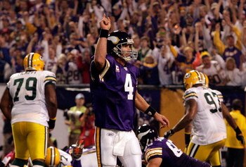 MINNEAPOLIS - OCTOBER 05:  Quarterback Brett Favre #4 of the Minnesota Vikings celebrates after a touchdown during the game against the Green Bay Packers on October 5, 2009 at Hubert H. Humphrey Metrodome in Minneapolis, Minnesota.  (Photo by Jamie Squire
