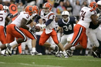 STATE COLLEGE, PA - SEPTEMBER 12: Quarterback Greg Paulus #2 of the Syracuse Orangemen hands off to running back Delone Carter #3 during the first half against the Penn State Nittany Lions at Beaver Stadium  September 12, 2009 in State College, Pennsylvan