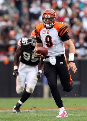 CLEVELAND - OCTOBER 04:  Carson Palmer #9 of the Cincinnati Bengals runs for a first down late in the overtime period against the Cleveland Browns during their game at Cleveland Browns Stadium on October 4, 2009 in Cleveland, Ohio. The Bengals defeated th