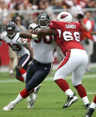 GLENDALE, AZ - AUGUST 18:  Defensive end Mario Williams #90 of the Houston Texans fights the block of tackle Mike Gandy #69 of the Arizona Cardinals during their NFL preseason game at University of Phoenix Stadium August 18, 2007 in Glendale, Arizona. (Ph