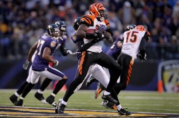 BALTIMORE - NOVEMBER 11:  Chad Johnson #85 of the Cincinnati Bengals makes a 20 yard pass reception for a first down in the first quarter as Willie Gaston #44 of the Baltimore Ravens makes the tackle at M&T Bank Staduim on November 11, 2007 in Baltimore, 