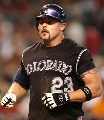 PHOENIX - SEPTEMBER 20:  Jason Giambi #23 of the Colorado Rockies crosses home plate after hitting a 2 run home run during the major league baseball game against the Arizona Diamondbacks at Chase Field on September 20, 2009 in Phoenix, Arizona.  The Rocki