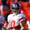 KANSAS CITY, MO - OCTOBER 04:  Quarterback Eli Manning #10 of the New York Giants gives a thumbs-up during pregame warm-ups just prior to the start of the game against the Kansas City Chiefs on October 4, 2009 at Arrowhead Stadium in Kansas City, Missouri