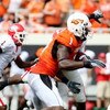 STILLWATER, OK - SEPTEMBER 5:  Wide receiver Dez Bryant #1 of the Oklahoma State Cowboys carries for an 18-yard return during the second quarter of the game against the Georgia Bulldogs at Boone Pickens Stadium on September 5, 2009 in Stillwater, Oklahoma