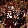 COLUMBIA, SC - SEPTEMBER 24:  Stephen Garcia #5 of the South Carolina Gamecocks celebrates with teammate Darian Stewart #24 after a 16-10 vicotry over the Ole Miss Rebels during their game at Williams-Brice Stadium on September 24, 2009 in Columbia, South