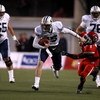 SALT LAKE CITY - NOVEMBER 22:  Max Hall #15 of the BYU Cougarsruns with the ball  against Brice McCain #1 of  the Utah Utes at Rice-Eccles Stadium on November 22, 2008 in Salt Lake City, Utah.  (Photo by Jonathan Ferrey/Getty Images)