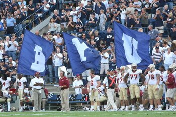 PROVO, UT. - SEPTEMBER 19:  Brigham Young Cougars flag bearers run around the field after a touchdown against the Florida State Seminoles at La Vell Edwards Stadium on September 19, 2009 in Provo, Utah.  (Photo by Melissa Majchrzak/Getty Images)