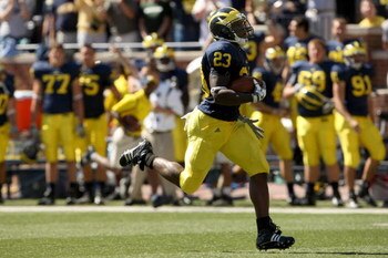 ANN ARBOR, MI - SEPTEMBER 19:  Running back Carlos Brown #23 of the Michigan Wolverines breaks away on  a 90 yard touchdown run against the Eastern Michigan Eagles at Michigan Stadium on September 19, 2009 in Ann Arbor, Michigan.  (Photo by Stephen Dunn/G