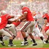 COLUMBUS, OH - SEPTEMBER 26:  Quarterback Terrelle Pryor #2 of the Ohio State Buckeyes hands off to running back Brandon Saine #3 of the Buckeyes during a game against the Illinois Fighting Illini at Ohio Stadium on September 26, 2009 in Columbus, Ohio.  