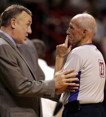MIAMI - JANUARY 22:  Head Coach Rick Adelman of the Sacramento Kings chats with Referee Dick Bavetta against the Miami Heat on January 22, 2006 at the American Airlines Arena in Miami, Florida.  (Photo by Eliot J. Schechter/Getty Images)