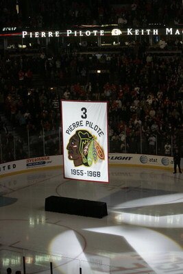 CHICAGO - NOVEMBER 12:  A banner retiring the number of former Chicago Blackhawks defenseman and NHL hall of famer Pierre Pilote is raised during a ceremony before the Chicago Blackhawks Boston Bruins game at the United Center on November 12, 2008 in Chic