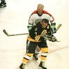 19 Jan 1996:  Wielding a double bladed stick, Gordie Howe #9 of the NHL Heroes checks Phil Esposito #7 of the Boston Bruins Heroes from behind during the second period of the NHL Heroes of Hockey game played at the Fleet Center in Boston, Massachusetts. M