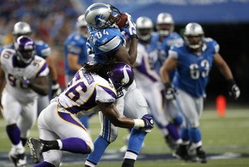 DETROIT - SEPTEMBER 20: Linebacker E.J. Henderson #56 of the Minnesota Vikings tackles wide receiver Brandon Pettigrew #84 of the Detroit Lions at Ford Field on September 20, 2009 in Detroit, Michigan. The Vikings won 27-13.  (Photo by Stephen Dunn/Getty 
