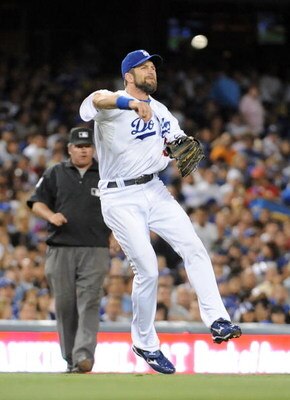 LOS ANGELES, CA - OCTOBER 02:  Casey Blake #23 of the Los Angeles Dodgers makes an off balance throw for an out against the Colorado Rockies during the sixth inning on October 2, 2009 in Los Angeles, California.  (Photo by Harry How/Getty Images)