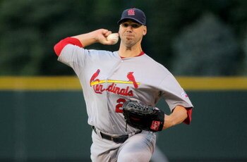 DENVER - SEPTEMBER 25:  Starting pitcher Chris Carpenter #29 of the St. Louis Cardinals delivers against the Colorado Rockies at Coors Field on September 25, 2009 in Denver, Colorado. The Rockies defeated the Cardinals 2-1.  (Photo by Doug Pensinger/Getty